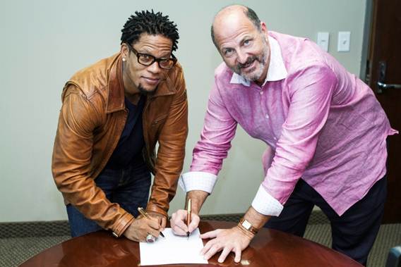 Photo Credit: Rance Elgin (left to right D.L. Hughley with David Kantor, REACH Media CEO)